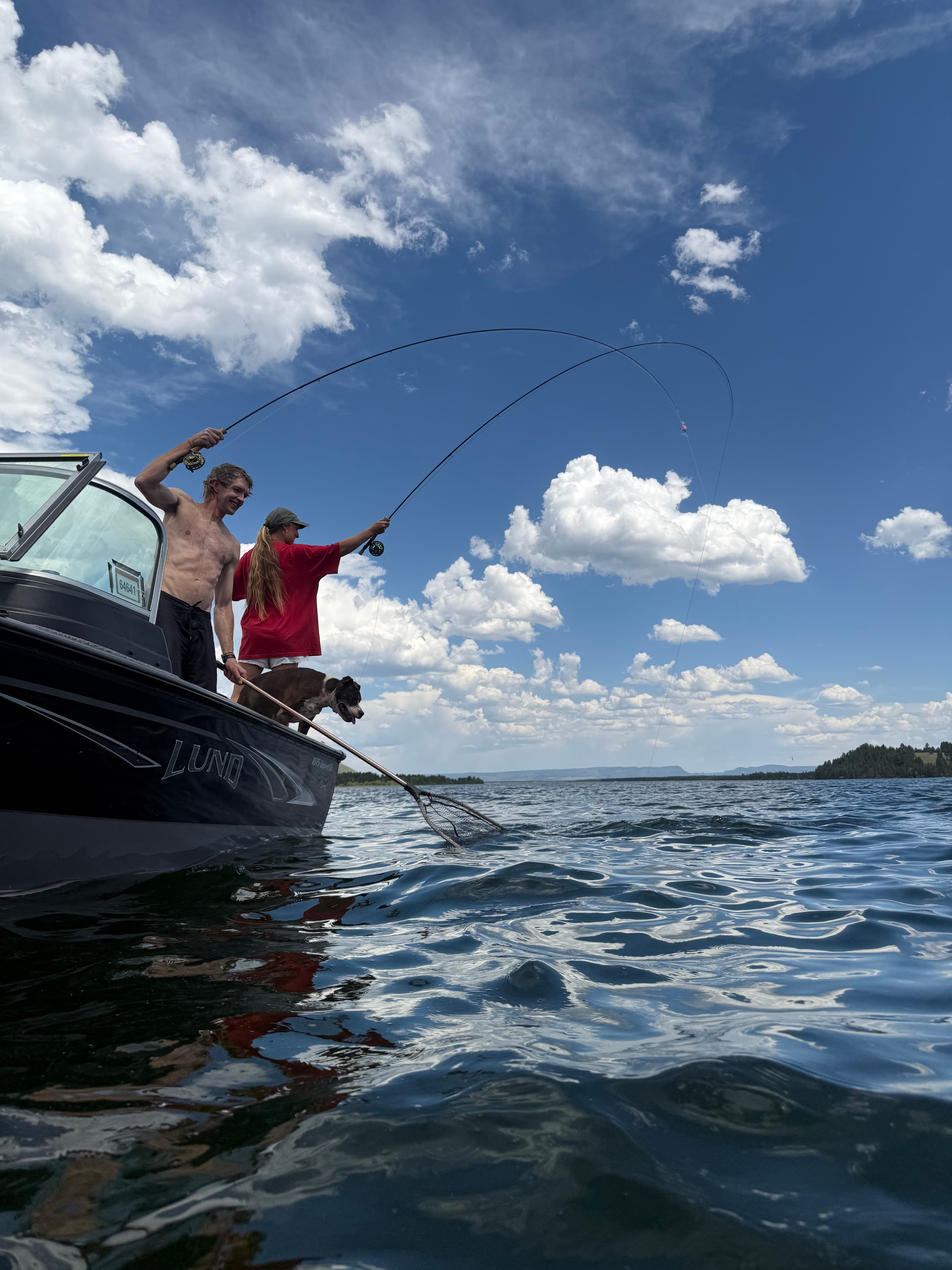 Fighting a fish from the Lund boat on Hebgen Lake